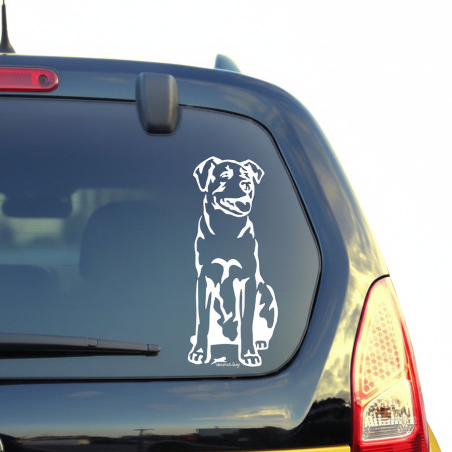 Weißer Bardino Aufkleber auf der Heckscheibe eines gelben Autos – wetterfestes Autoaufkleber-Motiv von amberdog